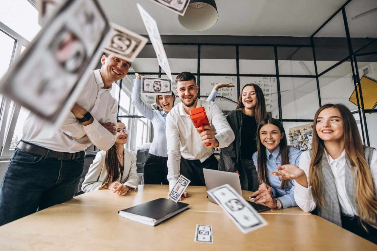 Happy office team celebrating success